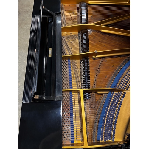 6 - Blüthner (1910)A 6ft 3in grand piano in an ebonised case on turned fluted legs. IRN: 289FFRPV