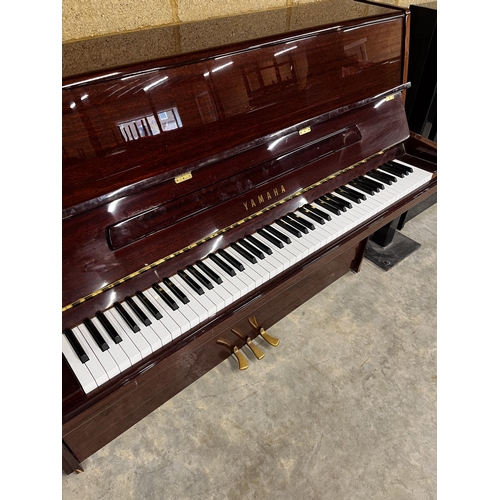 61 - Yamaha (c1998)A Model E116N upright piano in a bright mahogany case; together with a matching stool.... 