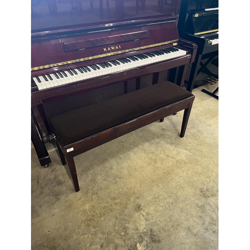 64 - Kawai (c1985)A Model BW 52 upright piano in a traditional bright mahogany case; together with a duet... 