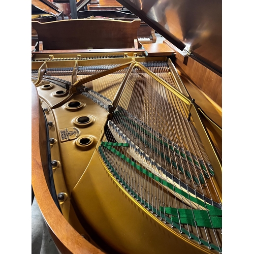 65 - Steinway (c1973)A 6ft 11in Model B grand piano in a mahogany case on square tapered legs; together w... 