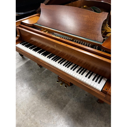 65 - Steinway (c1973)A 6ft 11in Model B grand piano in a mahogany case on square tapered legs; together w... 