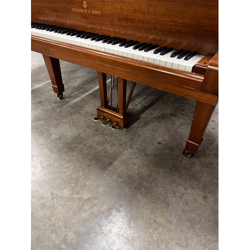 65 - Steinway (c1973)A 6ft 11in Model B grand piano in a mahogany case on square tapered legs; together w... 