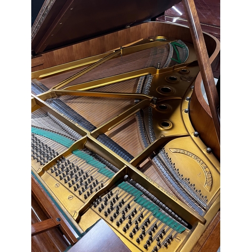 65 - Steinway (c1973)A 6ft 11in Model B grand piano in a mahogany case on square tapered legs; together w... 