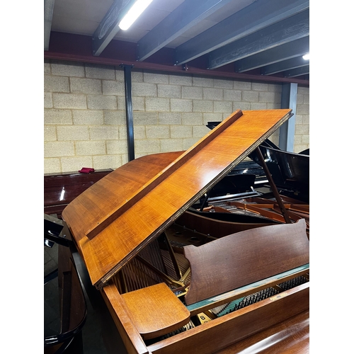 65 - Steinway (c1973)A 6ft 11in Model B grand piano in a mahogany case on square tapered legs; together w... 
