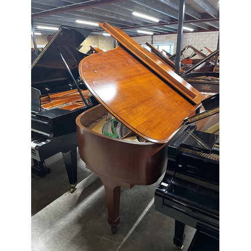 65 - Steinway (c1973)A 6ft 11in Model B grand piano in a mahogany case on square tapered legs; together w... 