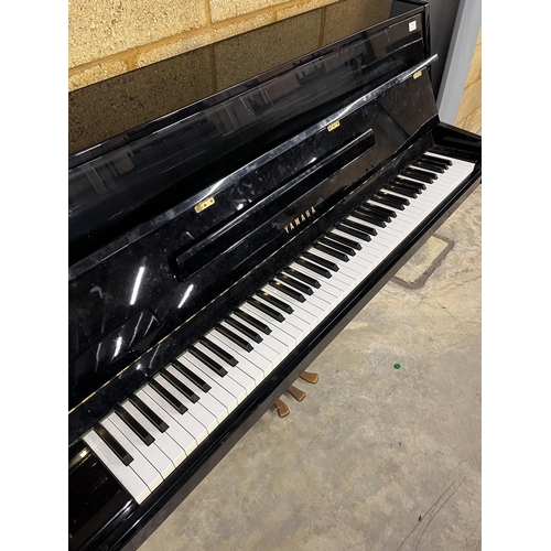 71 - Yamaha (c1985)A Model M1JR upright piano in a modern style bright ebonised case.