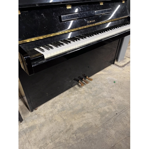 71 - Yamaha (c1985)A Model M1JR upright piano in a modern style bright ebonised case.