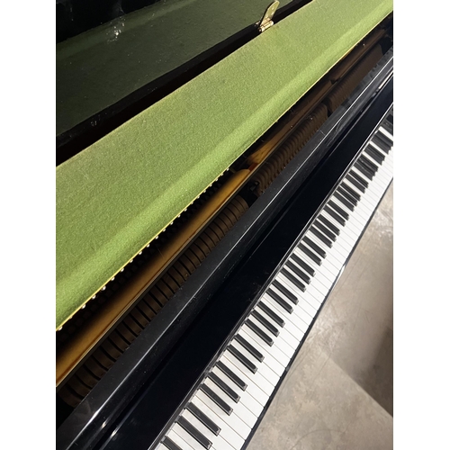 71 - Yamaha (c1985)A Model M1JR upright piano in a modern style bright ebonised case.