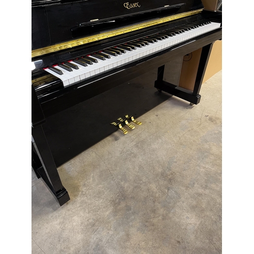 76 - *Essex (c2009)A Model 123 upright piano in a bright ebonised case. There is VAT on this Lot.