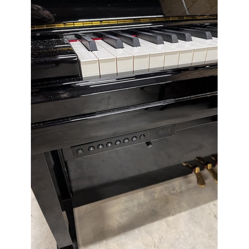 8 - Yamaha (c2015)A Model YUS 5S-Silent upright piano in a traditional bright ebonised case; fitted with... 