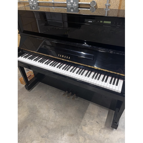 81 - Yamaha (c1991)A Model SX100 RB upright piano in a traditional bright ebonised case with an integral ... 