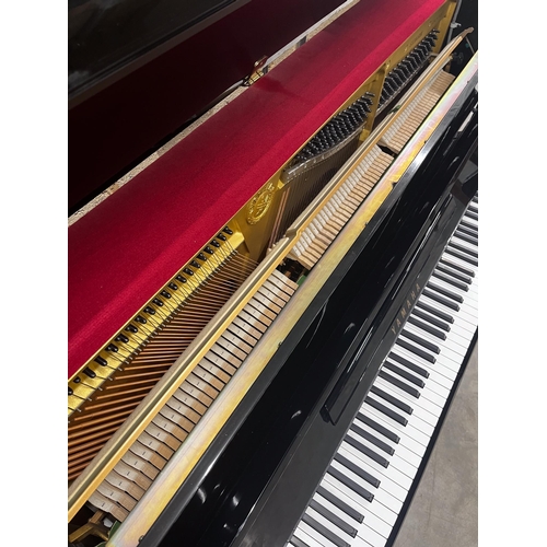81 - Yamaha (c1991)A Model SX100 RB upright piano in a traditional bright ebonised case with an integral ... 