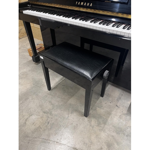 81 - Yamaha (c1991)A Model SX100 RB upright piano in a traditional bright ebonised case with an integral ... 