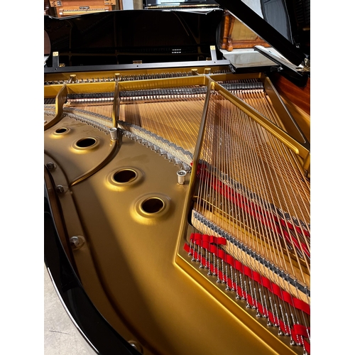 83 - Steinway (c1985)A 6ft 2in Model A grand piano in a bright ebonised case on square tapered legs; toge... 