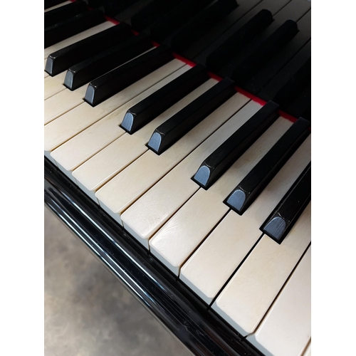 83 - Steinway (c1985)A 6ft 2in Model A grand piano in a bright ebonised case on square tapered legs; toge... 