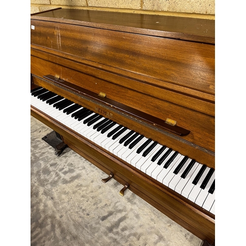 84 - Welmar (c1984)An upright piano in a mahogany case.