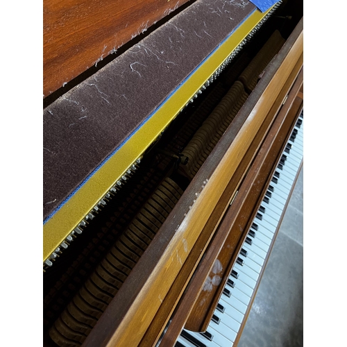 84 - Welmar (c1984)An upright piano in a mahogany case.