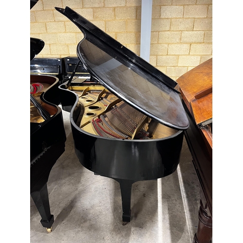 87 - Yamaha (c1980)A 6ft 7in Model C5 grand piano in a bright ebonised case on square tapered legs; toget... 