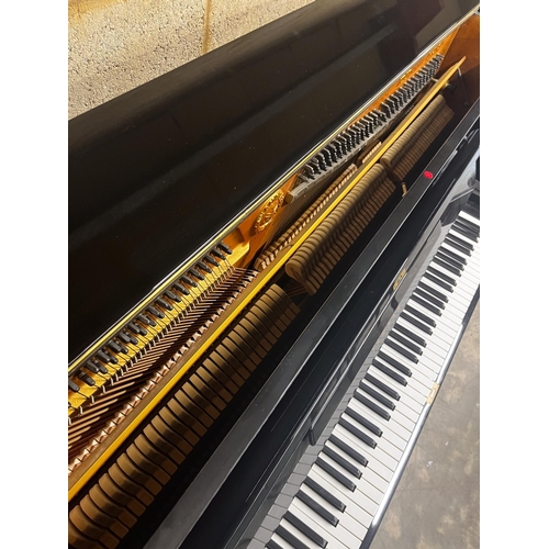 91 - Yamaha (1970)A Model U1 upright piano in a bright ebonised case; together with a stool.