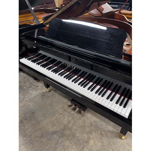 94 - Yamaha (c2009)A 4ft 11in Model GB1K grand piano in a bright ebonised case on square tapered legs; to... 