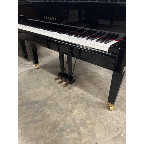 94 - Yamaha (c2009)A 4ft 11in Model GB1K grand piano in a bright ebonised case on square tapered legs; to... 