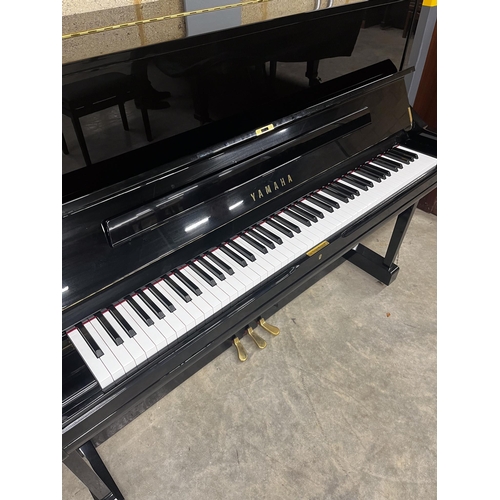 95 - Yamaha (c2022)A Model U1Q upright piano in a bright ebonised case; together with a matching stool. A... 