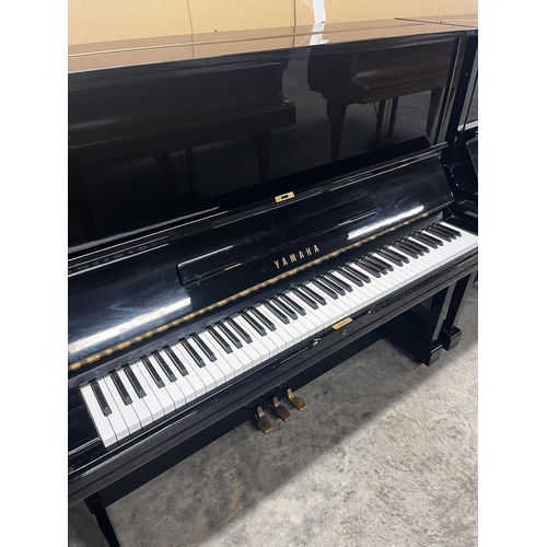 97 - Yamaha (c1978)A Model U3H upright piano in a bright ebonised case; together with a stool.