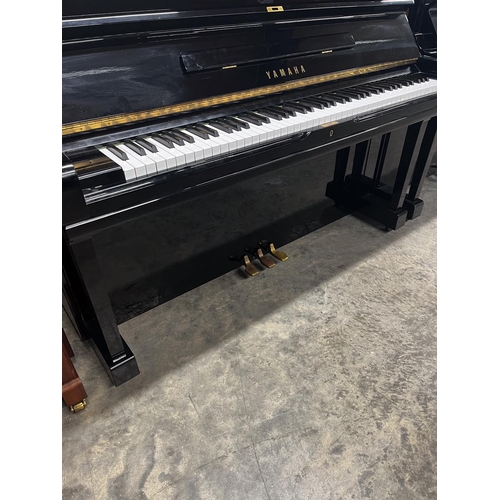 97 - Yamaha (c1978)A Model U3H upright piano in a bright ebonised case; together with a stool.