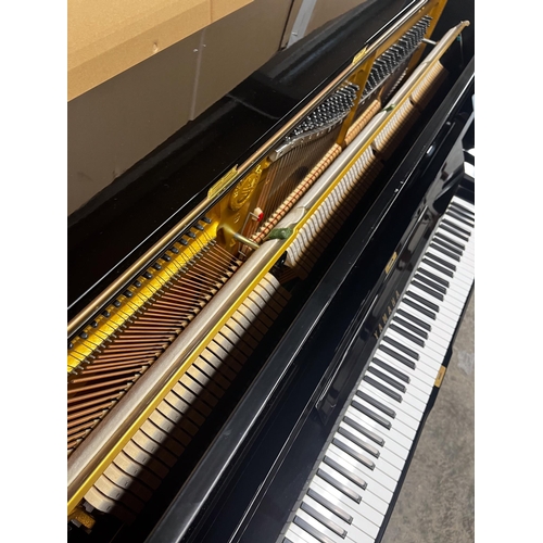 97 - Yamaha (c1978)A Model U3H upright piano in a bright ebonised case; together with a stool.