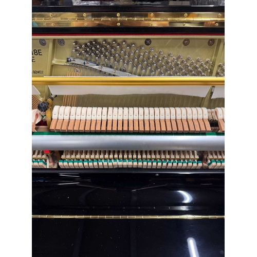 27 - Boston (c2019)A Model UP118 upright piano in a traditional bright ebonised case; together with a mat... 