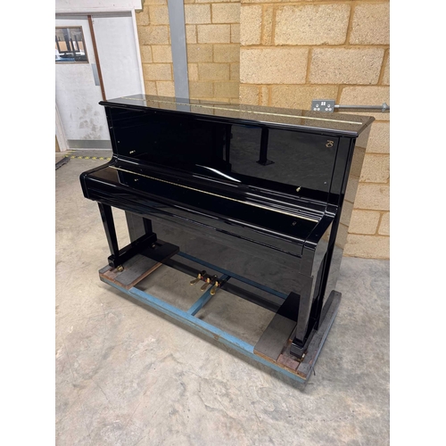 27 - Boston (c2019)A Model UP118 upright piano in a traditional bright ebonised case; together with a mat... 