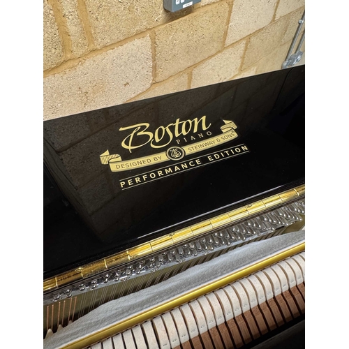 27 - Boston (c2019)A Model UP118 upright piano in a traditional bright ebonised case; together with a mat... 