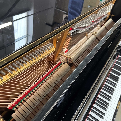 30 - Steinway (c2016)A Model K upright piano in a traditional bright ebonised case.