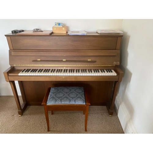 4 - Schimmel (c1993)An upright piano in a traditional satin walnut case; together with a stool.