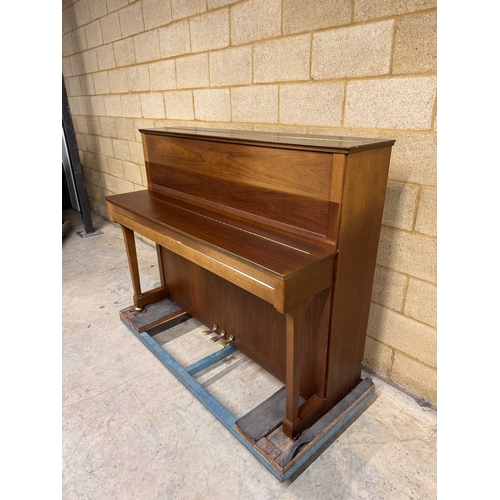 4 - Schimmel (c1993)An upright piano in a traditional satin walnut case; together with a stool.