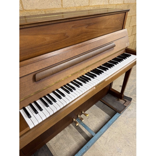 4 - Schimmel (c1993)An upright piano in a traditional satin walnut case; together with a stool.