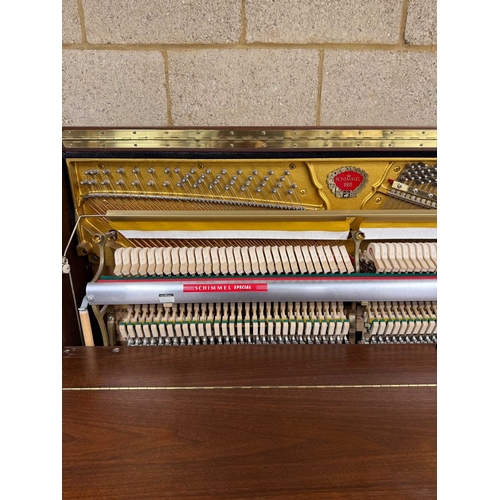 4 - Schimmel (c1993)An upright piano in a traditional satin walnut case; together with a stool.