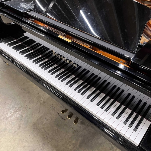 50 - *Bösendorfer (c2002)A 7ft 4in Model 225 grand piano in a bright ebonised case on square tapered legs... 