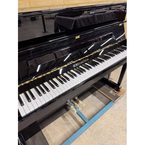 55 - Bechstein (c2012)A Model 118 Contur upright piano in a traditional bright ebonised case; together wi... 