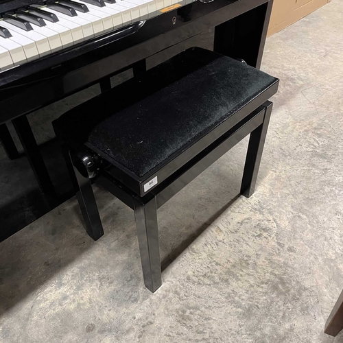 61 - Yamaha (c1973)A Model U2 upright piano in a bright ebonised case; together with a matching stool.... 