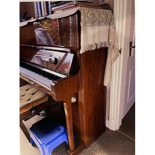 63 - Welmar (c1980s)An upright piano in a traditional bright mahogany case; together with a stool.