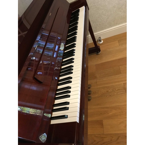 7 - Kemble (c1999)An upright piano in a traditional bright ebonised case; together with a stool.