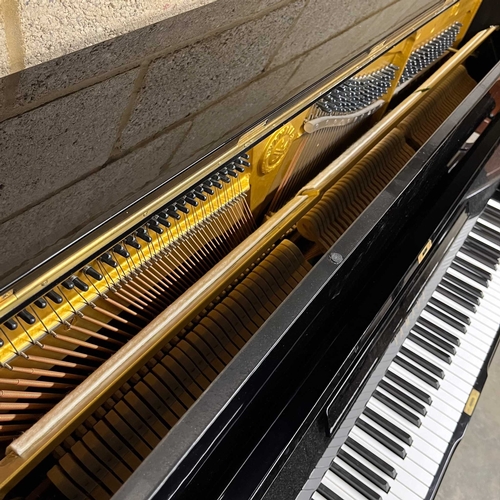 71 - Yamaha (c1975)A Model U1H upright piano in a bright ebonised case; together with a matching stool.... 