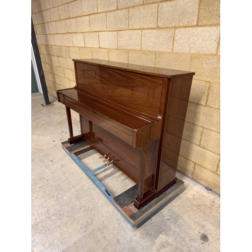 9 - Sauter (c1985)A Model 110 upright piano in a traditional bright mahogany case; together with a stool... 