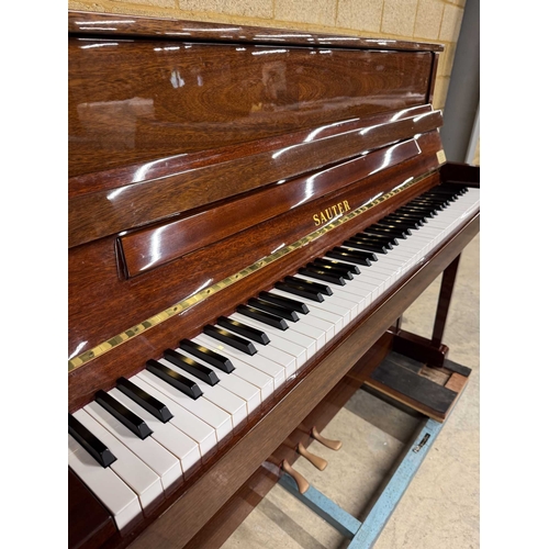 9 - Sauter (c1985)A Model 110 upright piano in a traditional bright mahogany case; together with a stool... 