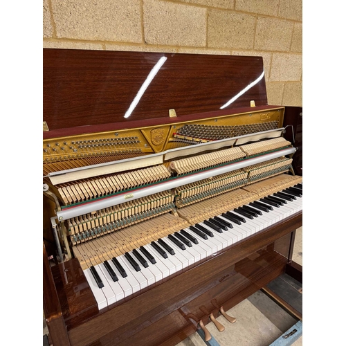 9 - Sauter (c1985)A Model 110 upright piano in a traditional bright mahogany case; together with a stool... 