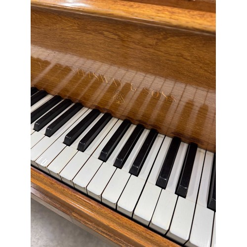 5 - Steinway (c1922)A 5ft 10in Model O grand piano in a rosewood case on square tapered legs; together w... 