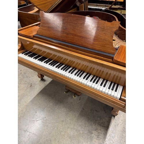 5 - Steinway (c1922)A 5ft 10in Model O grand piano in a rosewood case on square tapered legs; together w... 