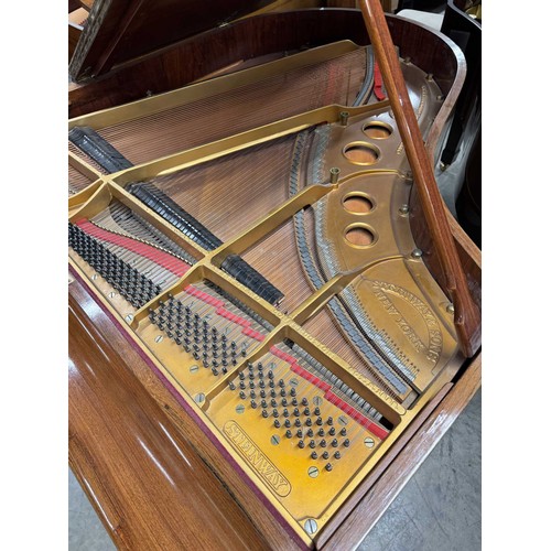 5 - Steinway (c1922)A 5ft 10in Model O grand piano in a rosewood case on square tapered legs; together w... 