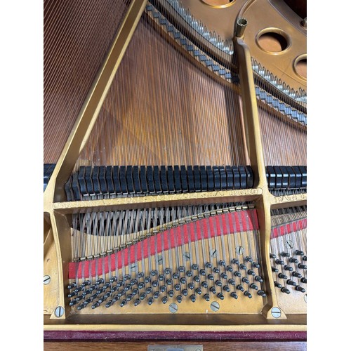 5 - Steinway (c1922)A 5ft 10in Model O grand piano in a rosewood case on square tapered legs; together w... 